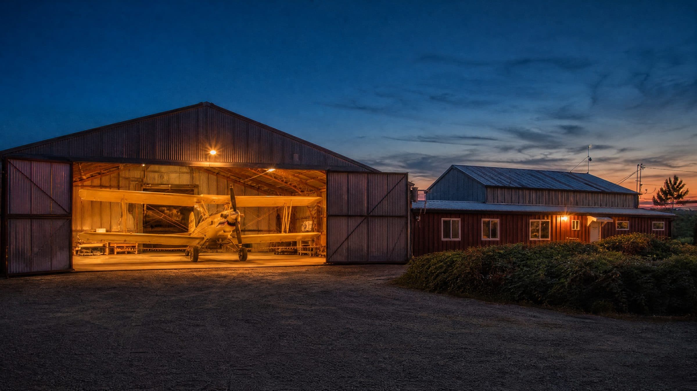 The Sutter Butte Dusters hangar and office at dusk